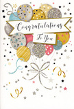 The image presents a refined congratulations card, photographed upright as if waiting beside a fresh bouquet on a Rush Green kitchen table. The design on the front is a joyful, balloon-filled scene, rendered in soft, sophisticated colours rather than bright primary tones. Rounded balloons in metallic gold, silver, and champagne are interwoven with hints of sky blue, gentle blush pink, and misty grey, each balloon lightly patterned with stars, slender stripes, or dustings of glitter that suggest a subtle twinkle when turned toward the light. They gather into a loose cluster that rises toward the top edge, like a balloon bouquet tied at a local celebration near Rush Green Park. From the base of the cluster, thin golden and silvery ribbons cascade in curving lines, looping and spiralling as though lifted by a gentle draft, adding a sense of liveliness and depth. Around the balloons, the soft background is speckled with tiny stars, dots of confetti, and delicate swirls, evoking the giddy atmosphere right after someone hears wonderful news. Across the middle of the card, a graceful banner floats horizontally, bearing the words Congratulations To You in flowing, slightly decorative script that feels both personal and polished. The overall effect is of a calm yet unmistakable festivity, suitable for marking exams, promotions, retirements, or any milestone that calls for flowers and a thoughtful card. As a florist used to pairing designs like this with hand-tied arrangements for homes off Romford Road, I recognise how the tidy composition and luminous colours quietly amplify the emotion, turning simple congratulations into a keepsake moment.